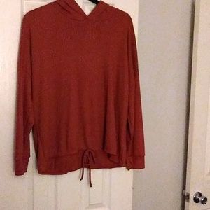 A sweater with a hood